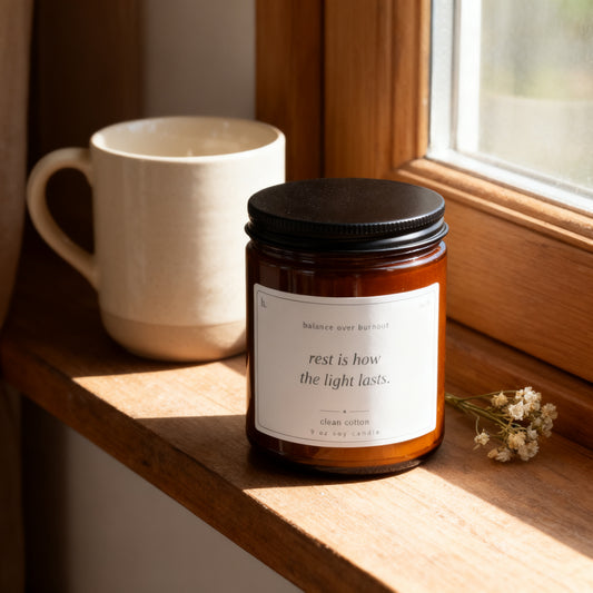 b.steady clean cotton candle on a sunlit windowsill with a ceramic mug and dried flowers